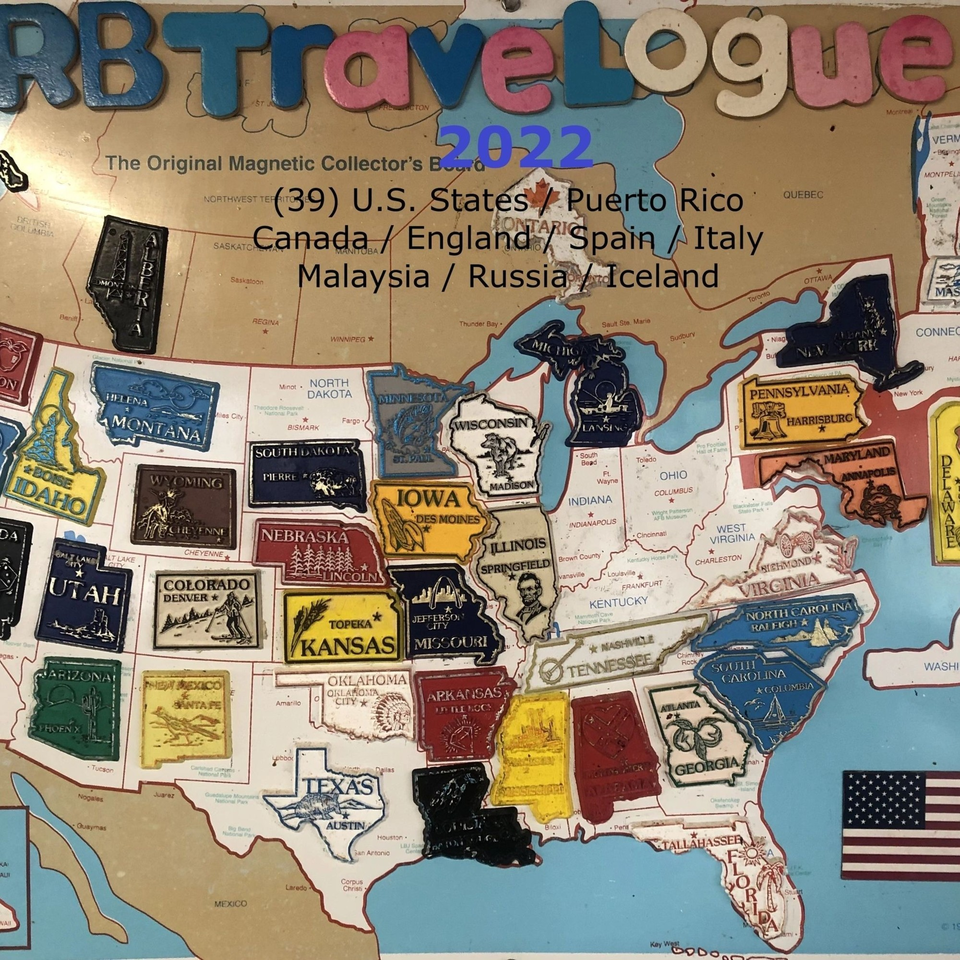 A magnetic travel map with various US states and countries represented by magnetic pieces.