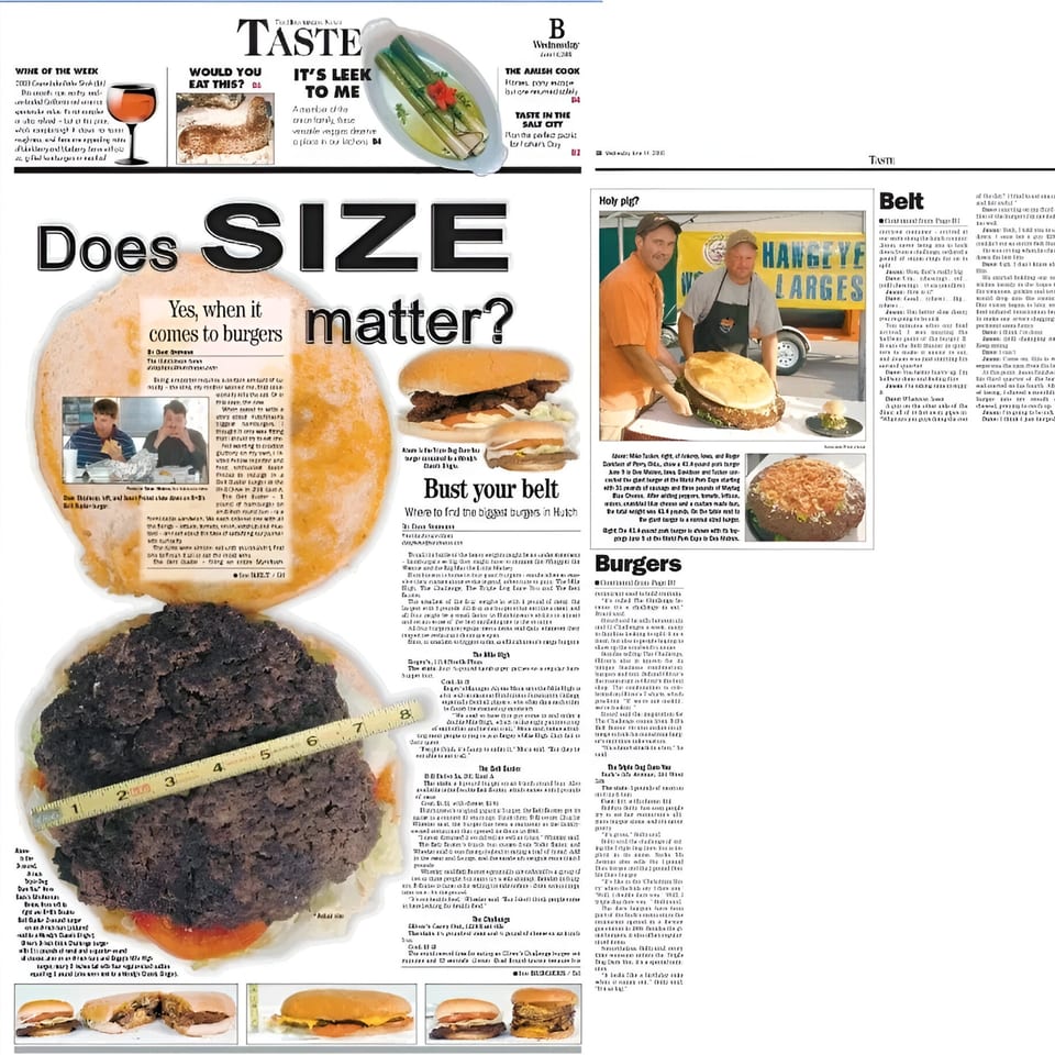 A giant R-B Drive In burger patty with lettuce and tomato, measured by a yellow tape.