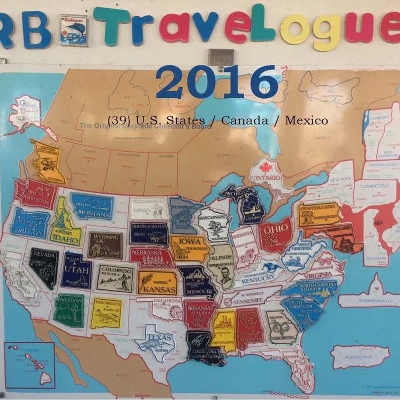 A magnetic map of the US, Canada, and Mexico with many state magnets in place.