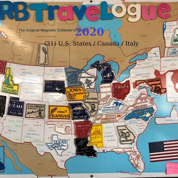 A magnetic map of the US, Canada, and Italy with state and province magnets.