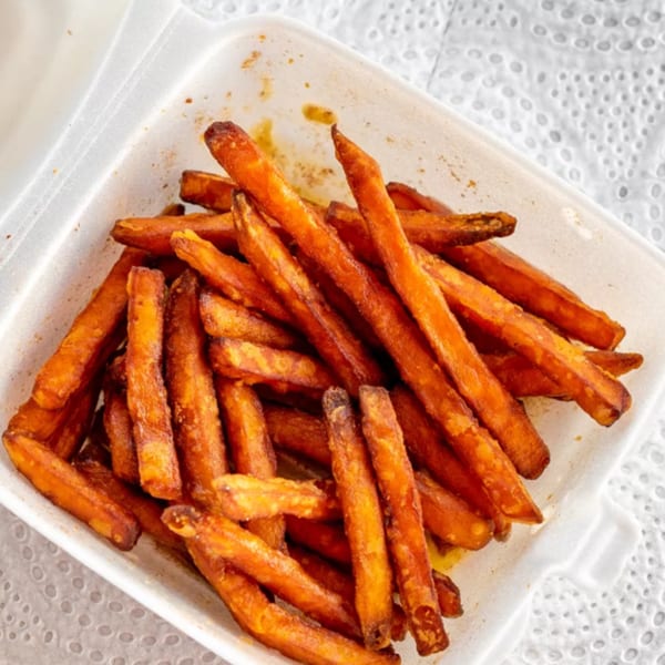 Sweet potato fries from R-B Drive In, served in a white takeout container.